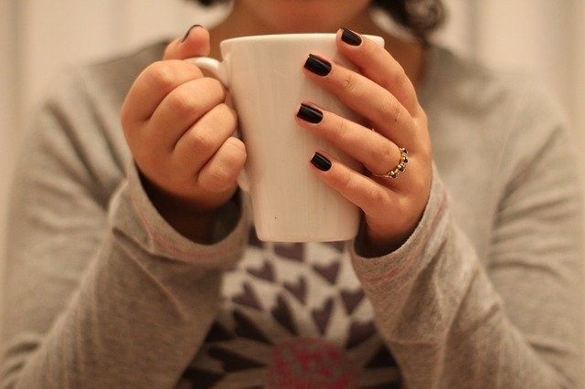 Lady holding a mug of tea